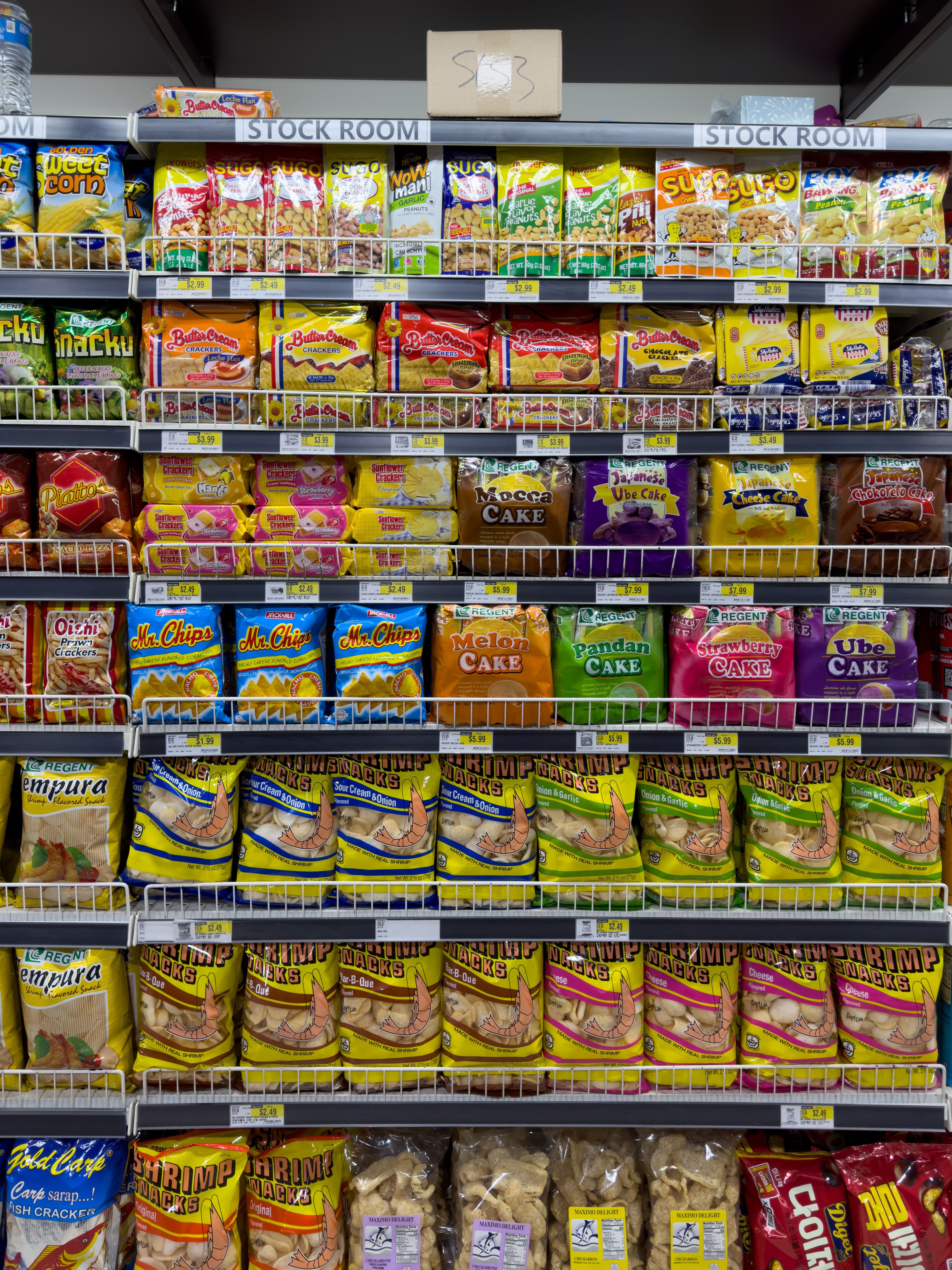 Organized retail snack shelves stocked with packaged products