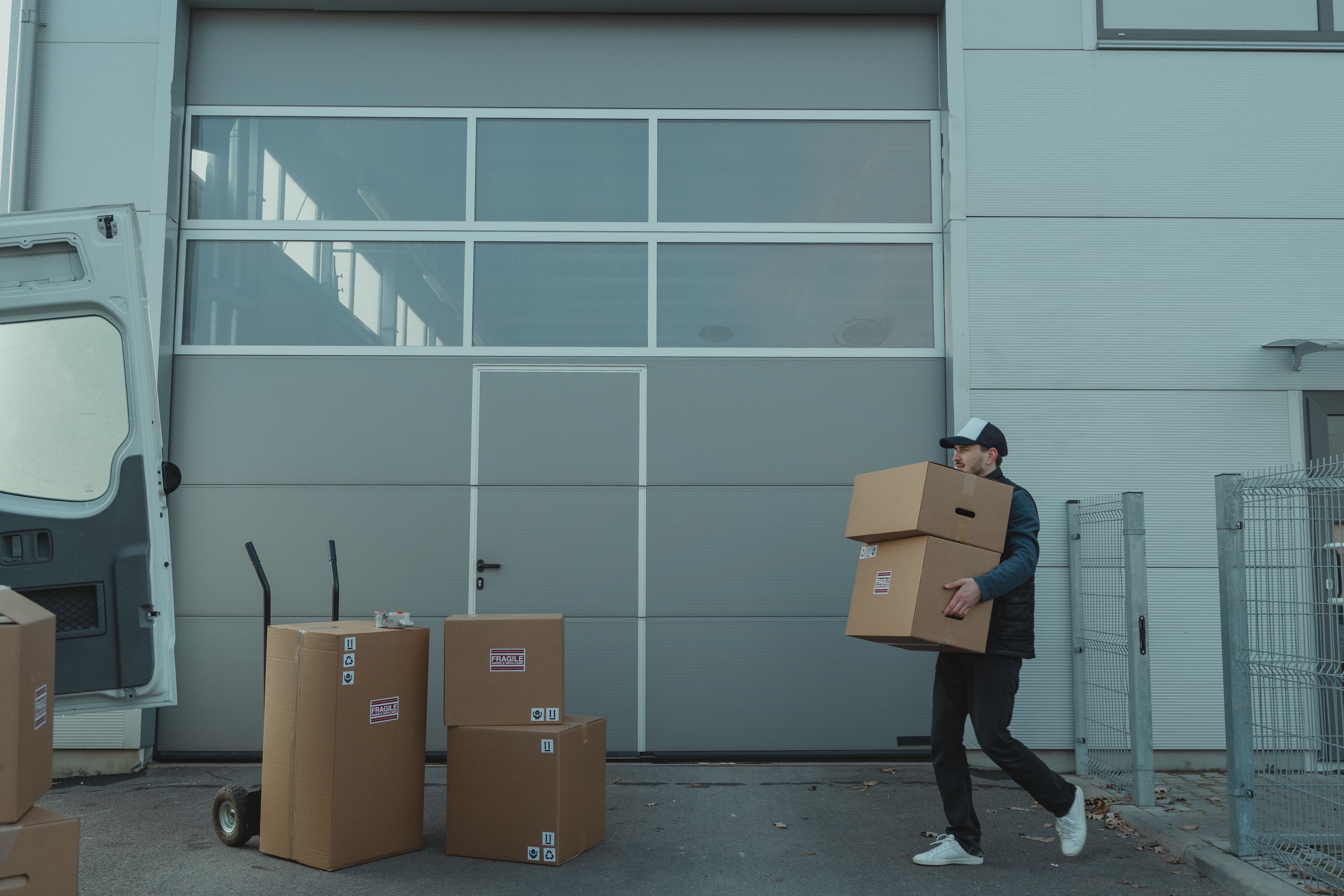 Delivery worker handling product during distribution operations