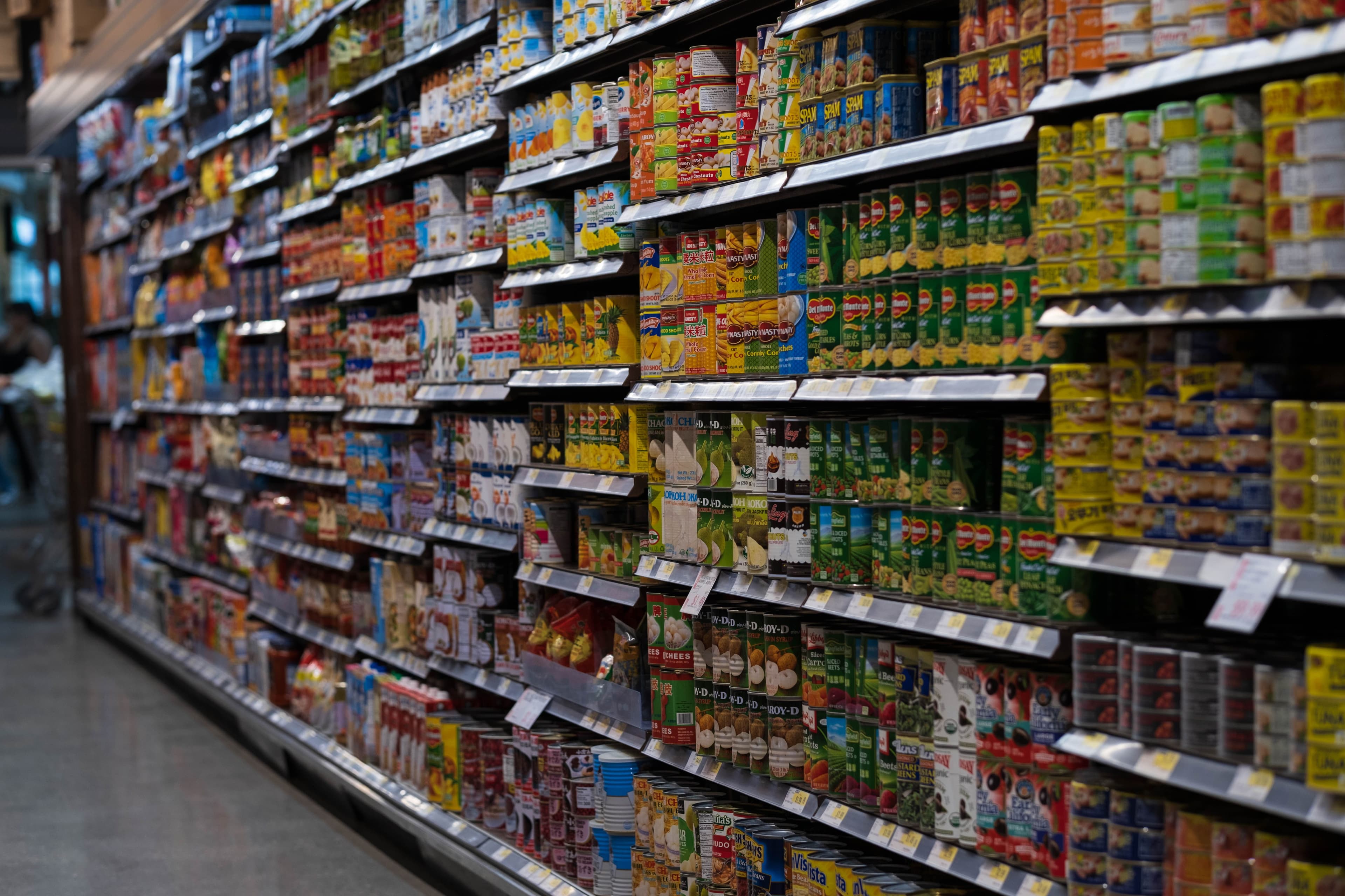 Retail grocery aisle with stocked shelves